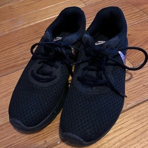 Black and rose gold Nike tennis shoes